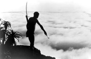 N!xau jako Xi v Bohové musejí být šílení